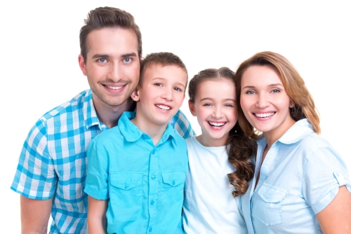 Dental hygienist performing a professional cleaning and exam