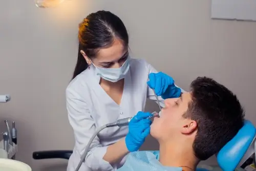 Dentist performing Dental Filling