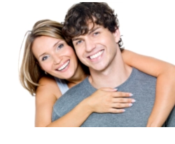 Dentist applying composite veneer to correct chipped tooth